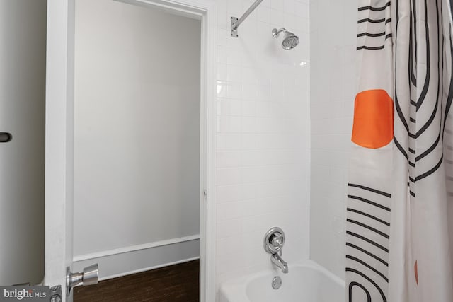 bathroom featuring shower / tub combo and hardwood / wood-style flooring