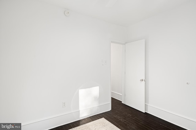 unfurnished room featuring dark hardwood / wood-style floors