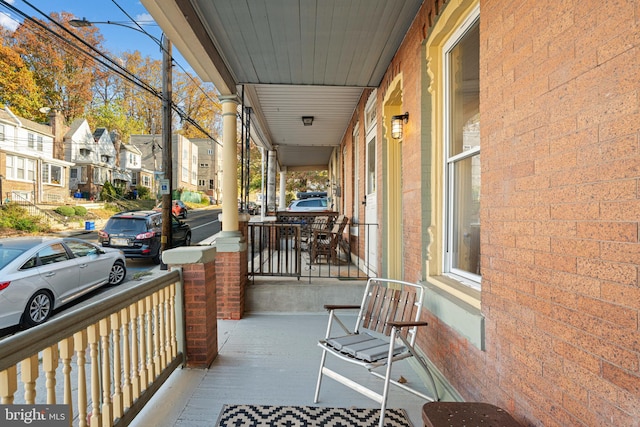 balcony featuring covered porch