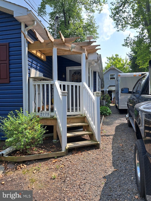 view of side of home with a pergola