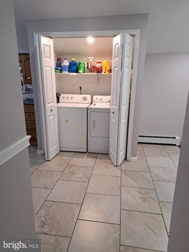 laundry area with independent washer and dryer and a baseboard radiator