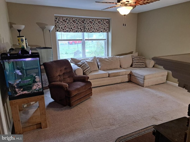 carpeted living room featuring ceiling fan