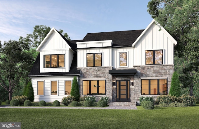 modern inspired farmhouse with board and batten siding, stone siding, and a front lawn