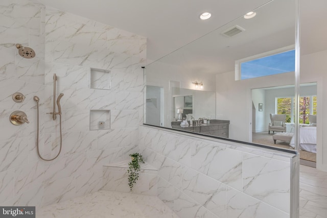bathroom featuring ensuite bath, a tile shower, recessed lighting, a towering ceiling, and vanity