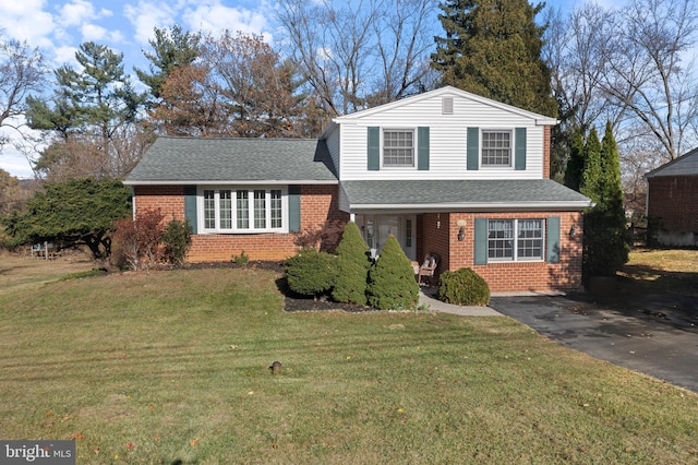 tri-level home featuring a front yard