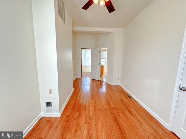 spare room with light hardwood / wood-style floors and ceiling fan