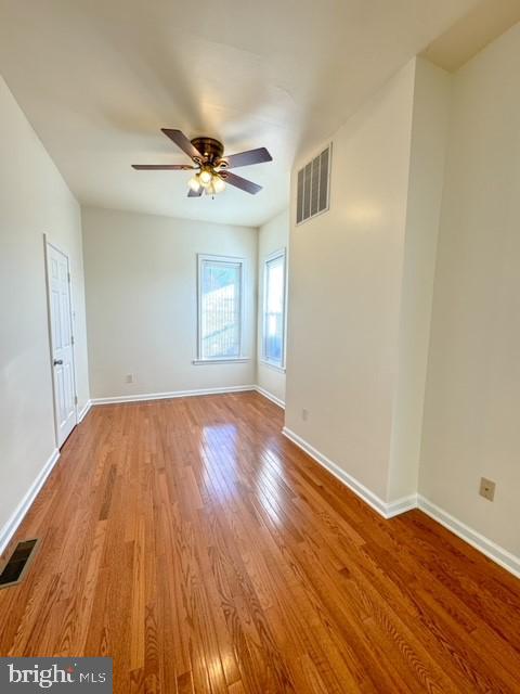 unfurnished room with light hardwood / wood-style floors and ceiling fan