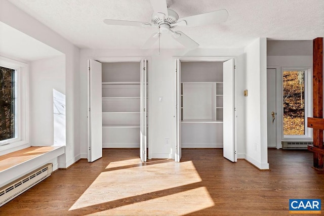 closet featuring a baseboard heating unit