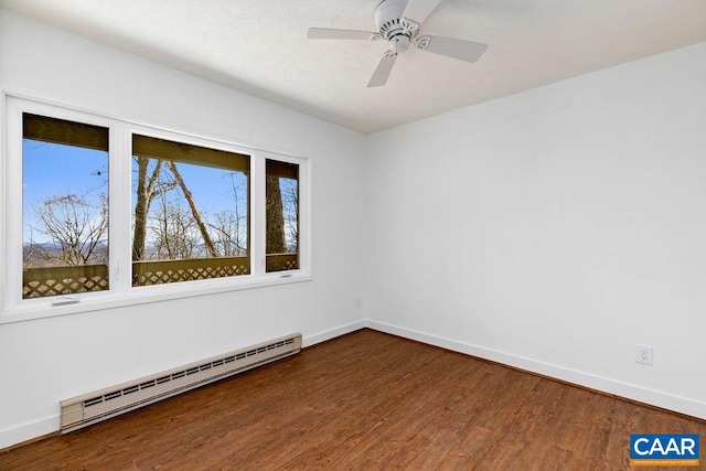 empty room featuring hardwood / wood-style flooring, ceiling fan, and a baseboard radiator