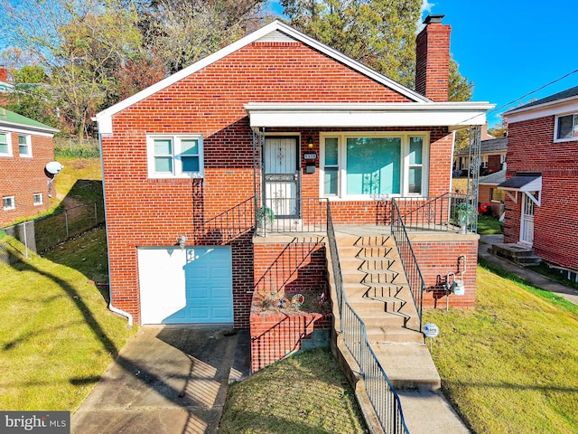 bungalow-style home with a garage and a front lawn