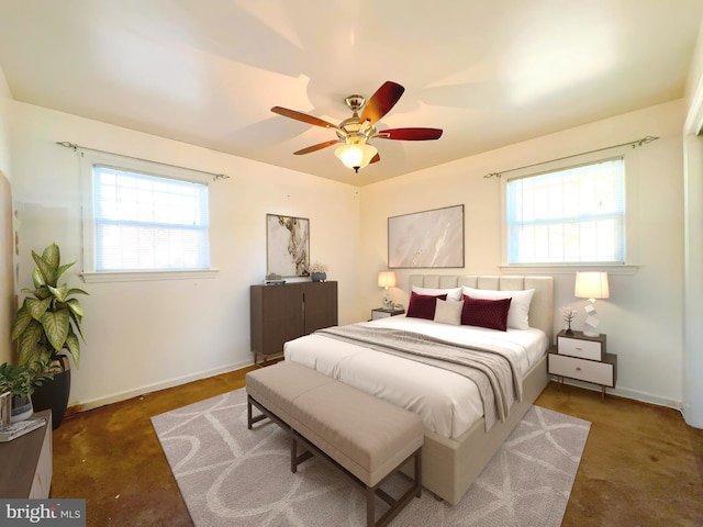 bedroom with multiple windows and ceiling fan