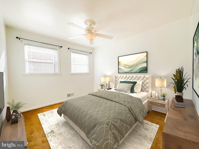 carpeted bedroom with ceiling fan