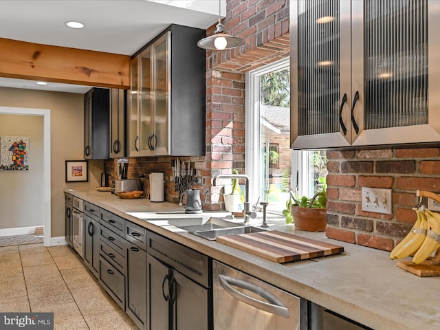 kitchen with decorative backsplash, sink, pendant lighting, and dishwasher