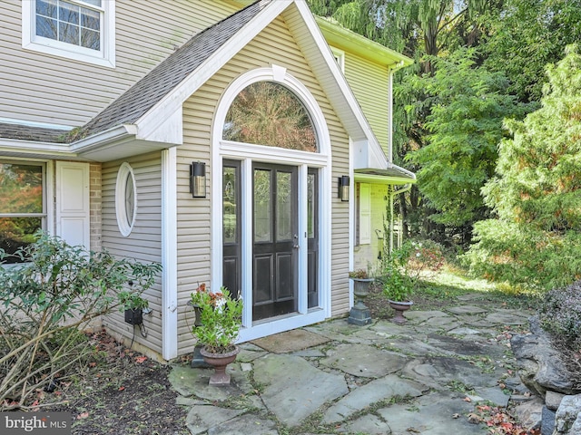 entrance to property featuring a patio