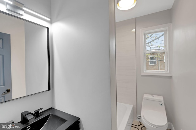 bathroom featuring sink and toilet