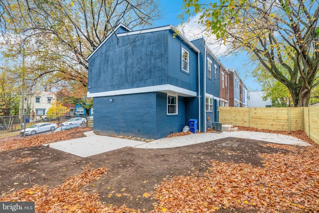 back of house featuring a patio and central AC unit