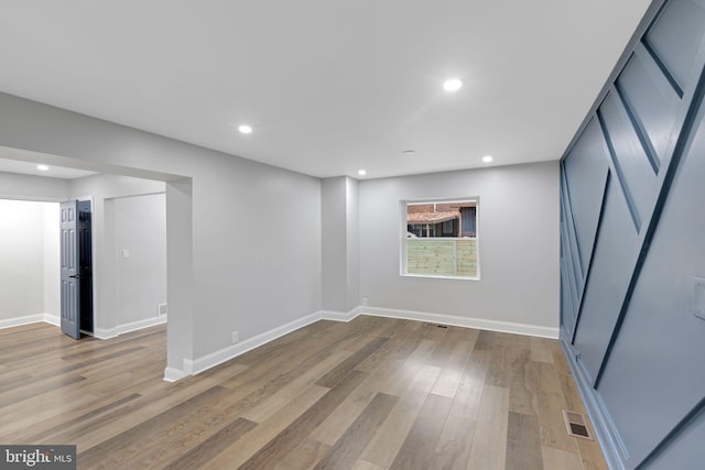 spare room with light hardwood / wood-style floors