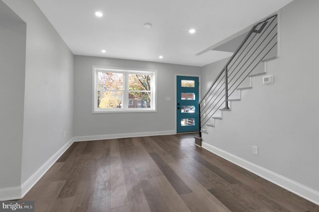 foyer with dark hardwood / wood-style flooring