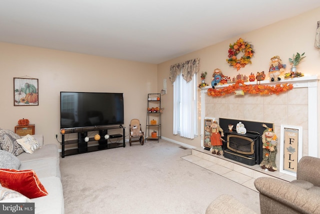 living room with carpet flooring and a wood stove