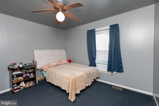 bedroom with ceiling fan and carpet floors