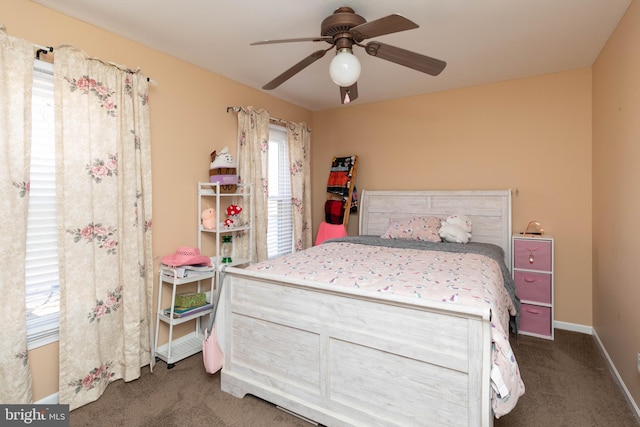 bedroom featuring dark carpet and ceiling fan