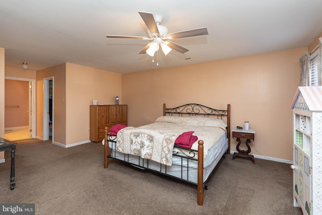 bedroom featuring carpet, ceiling fan, and connected bathroom