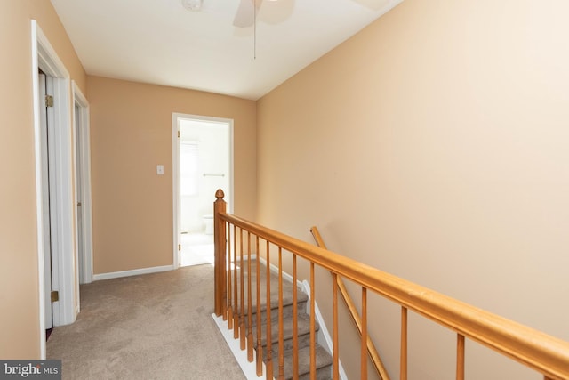 corridor featuring light carpet