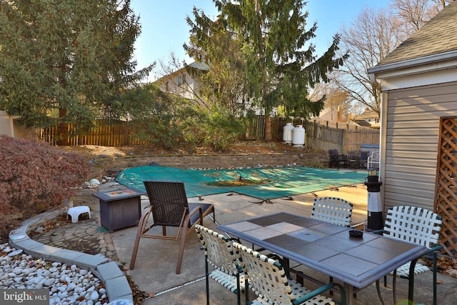 view of patio / terrace with a covered pool