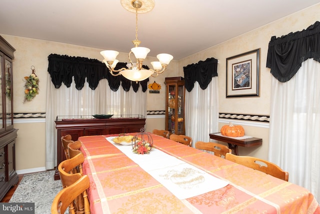 dining area featuring a notable chandelier