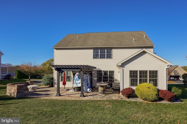 back of property featuring a patio area, a pergola, and a yard