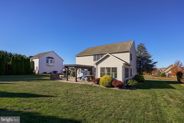 back of property with a patio area, a pergola, and a lawn