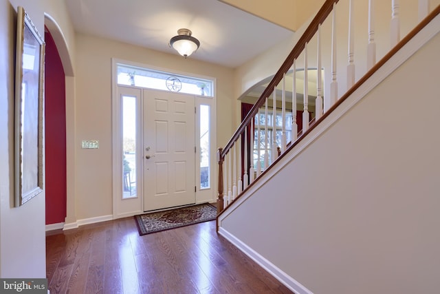 foyer featuring dark wood-type flooring