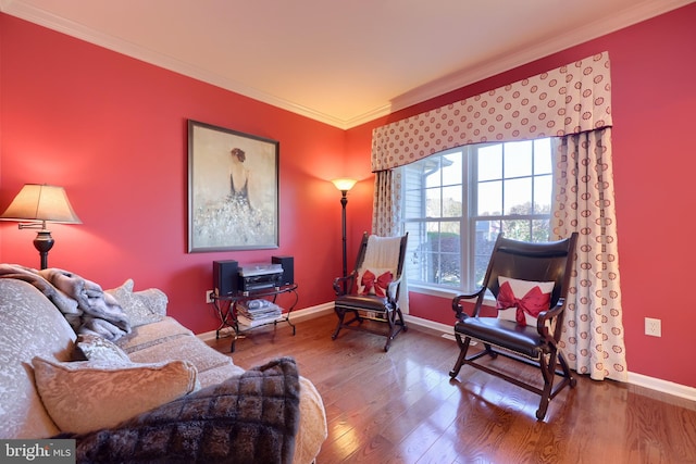 living room featuring hardwood / wood-style floors and ornamental molding