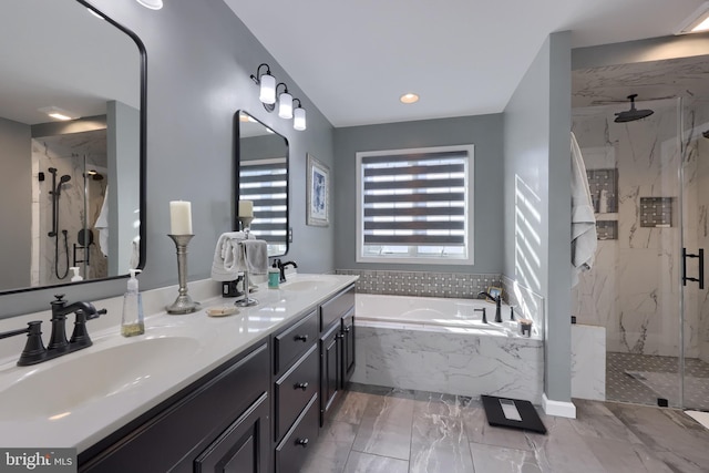 bathroom featuring independent shower and bath and vanity