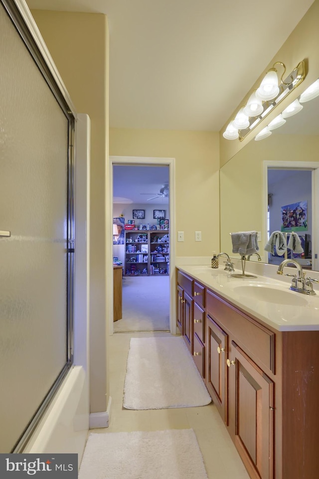 bathroom featuring shower / bath combination with glass door, vanity, and tile patterned floors