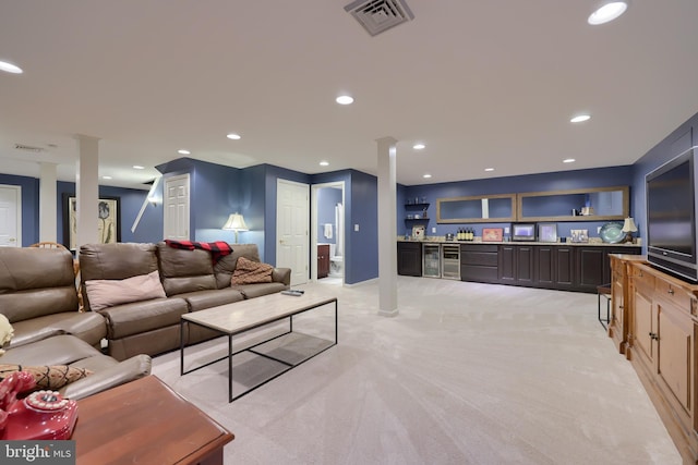 living room featuring light colored carpet and beverage cooler