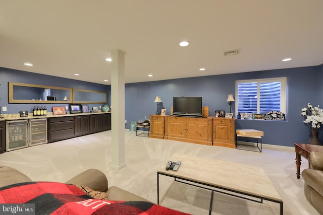 living room featuring light carpet, wine cooler, and indoor bar