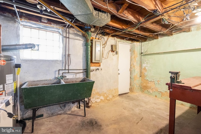 basement featuring electric panel, sink, and gas water heater