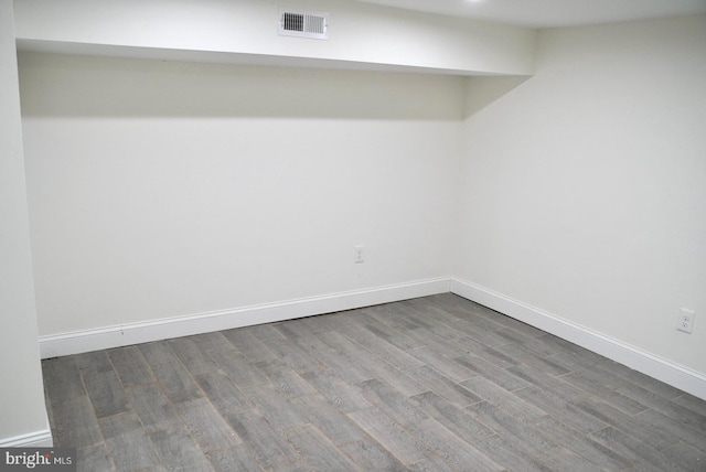 empty room with hardwood / wood-style floors