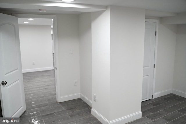 corridor with dark hardwood / wood-style floors