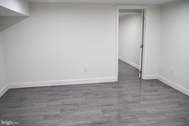 spare room featuring wood-type flooring