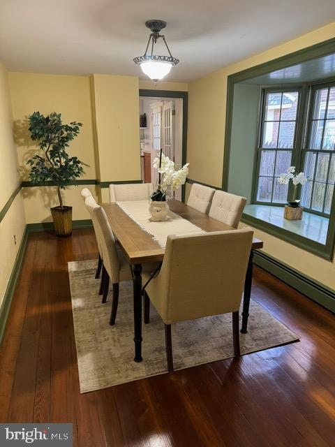 28 The Strand, New Castle, DE 19720 - dining room with hardwood / wood-style flooring, a baseboard radiator, and baseboards