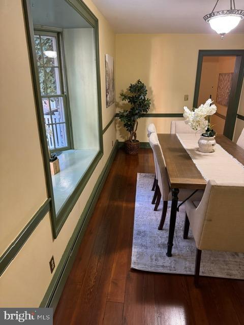 28 The Strand, New Castle, DE 19720 - dining room featuring dark wood-type flooring and baseboards