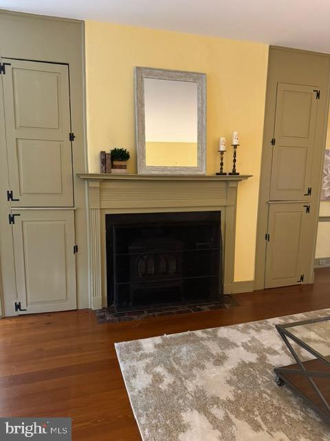 28 The Strand, New Castle, DE 19720 - living room featuring a fireplace with flush hearth and wood finished floors