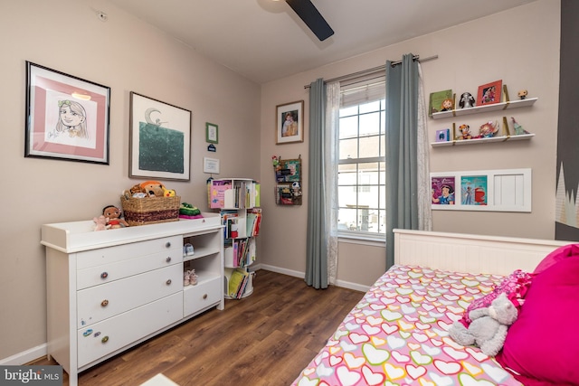 bedroom with ceiling fan and dark hardwood / wood-style flooring