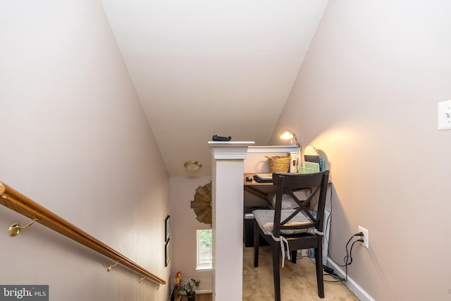 stairs featuring carpet flooring and vaulted ceiling