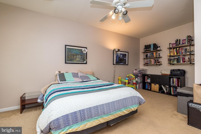 bedroom featuring ceiling fan and light carpet