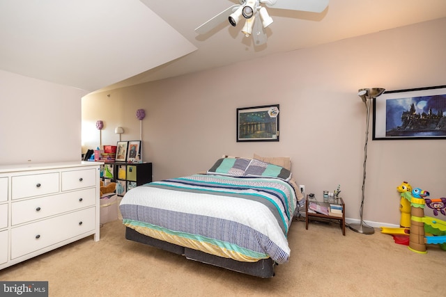 carpeted bedroom featuring ceiling fan and lofted ceiling