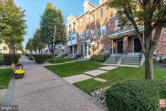 view of community featuring a yard