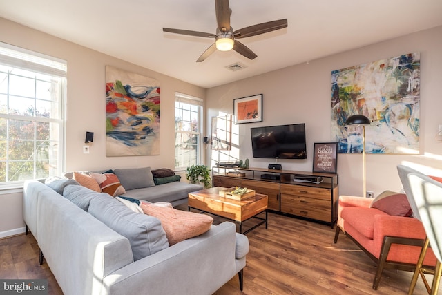 living room featuring hardwood / wood-style floors, ceiling fan, and a healthy amount of sunlight